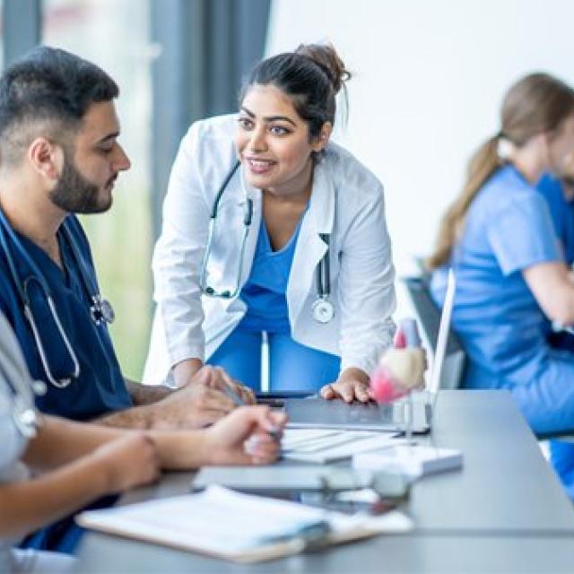 Premed Lecture Series: Students scrubs in a classroom