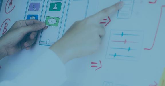 Person pointing at flow chart of user experience design