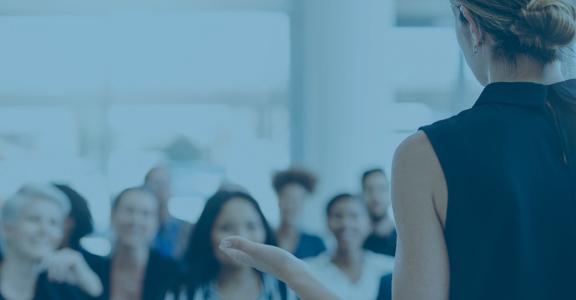 woman talking to crowd
