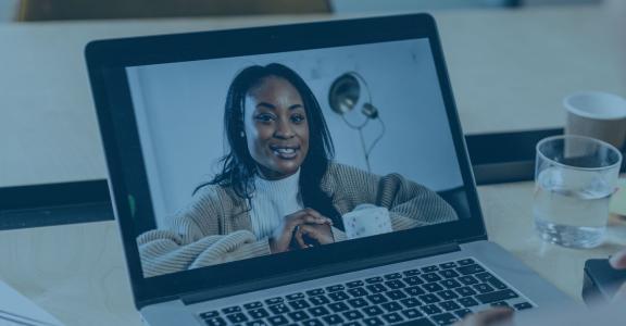 Two women talking to each other virtually.