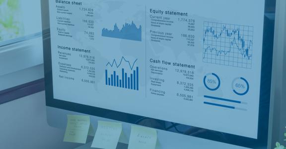 person looking at computer screen with analytics